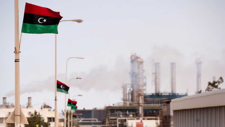 The new Libyan flag flutters outside an